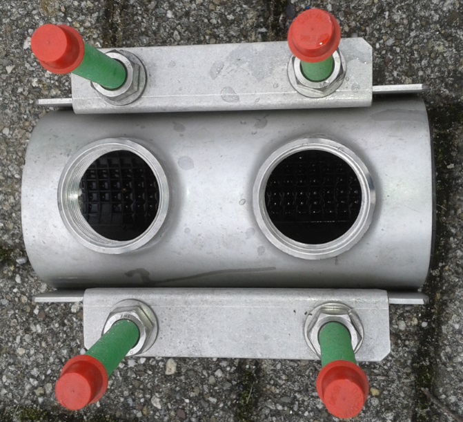 Repair clamp with double threaded outlet